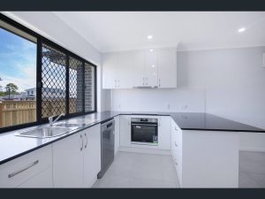 New kitchen design with Caesarstone benchtops and white 2 pak cabinets 